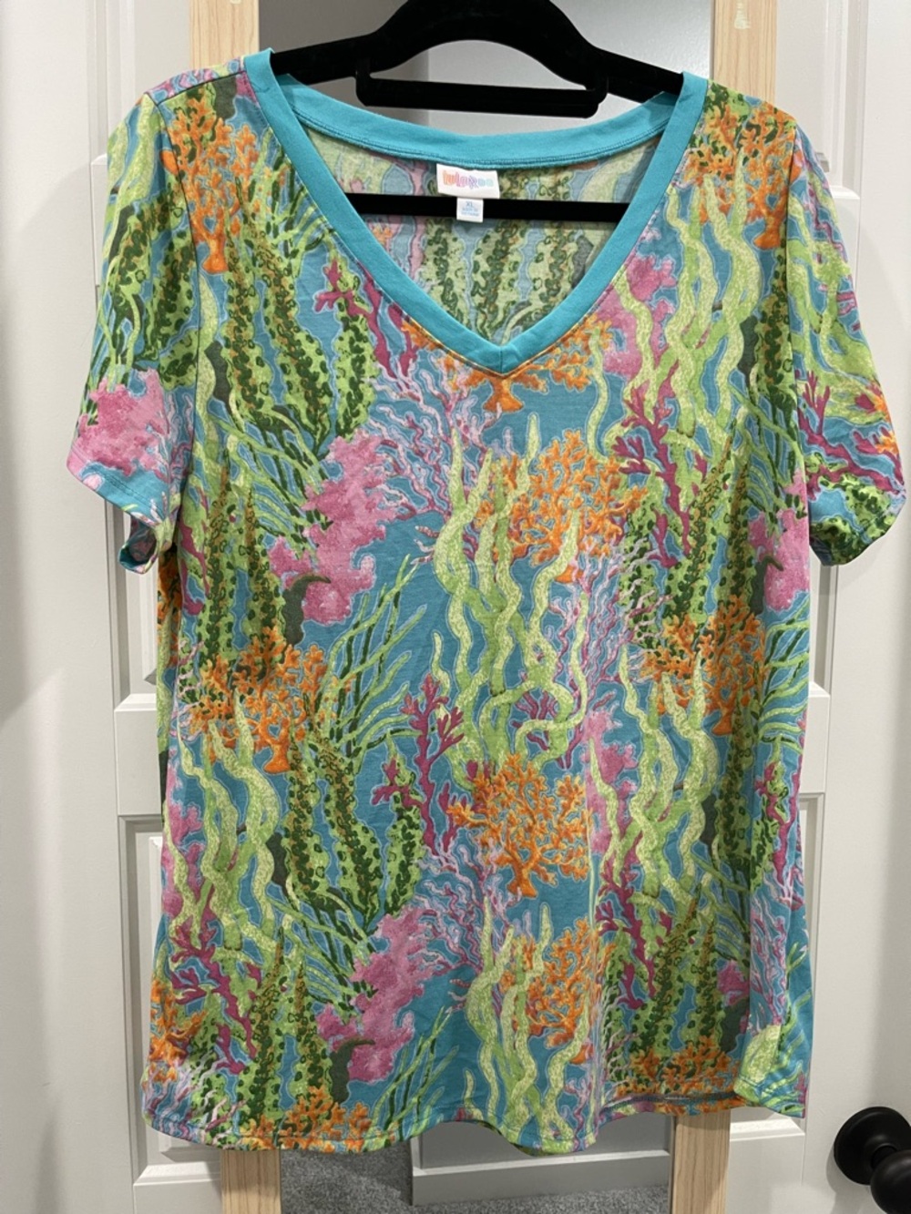 LuLaRoe Short Sleeve V-Neck Tee in Teal with Pink, Orange, Green Pattern
